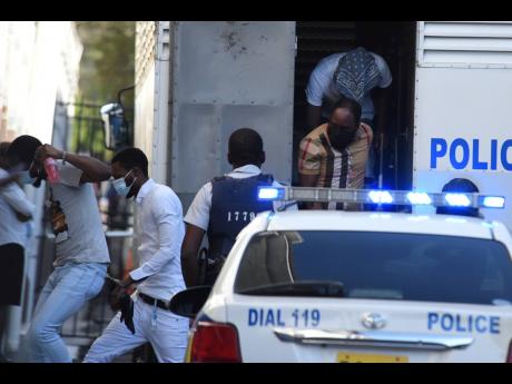 Defendants in the Clansman-One Don gang trial arrive for another day of testimony.