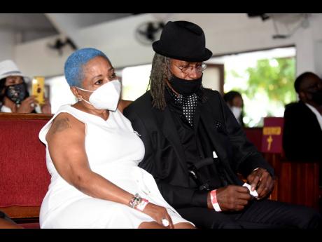 Marian Shakespeare (left) widow of legendary bassist Robbie Shakespeare, consoles drummer Sly Dunbar with whom the late musician formed a dynamic duo, responsible for numerous hits. Shakespeare’s funeral was held at Webster Memorial Church on Half-Way Tree Road in St Andrew yesterday. Shakespeare, one of reggae’s most influential bassists, died at a hospital in Miami, Florida, on December 8 last year. He was 68.