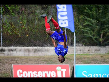 Atapharoy ByGrave of Dunbeholden celebrates scoring a equalising goal in the nick of time against Mount Pleasant Football Academy, thus securing a point for his team in the Jamaica Premier League football match at the UWI-JFF Captain Horace Burrell Centre of Excellence in St. Andrew on Sunday. The game ended 1-1.