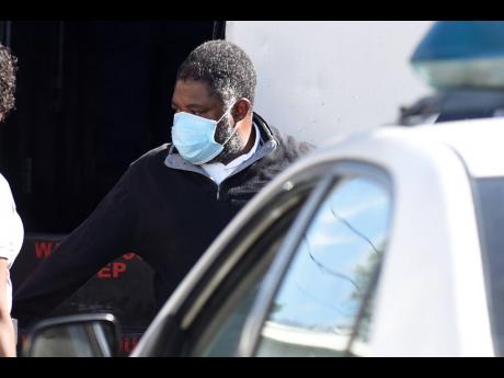 John Joel Joseph heads into the Kingston and St Andrew Parish Court.