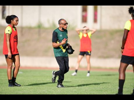Reggae Girlz head coach Vin Blaine at a training session held at Stadium East in St Andrew yesterday. The Reggae Girlz will kick off their World Cup Campaign against Bermuda tomorrow at the National Stadium.