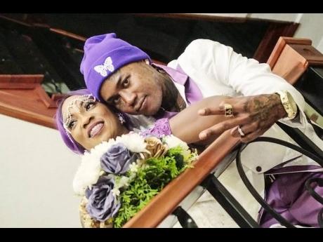 The loving couple share lens time after their nuptials.