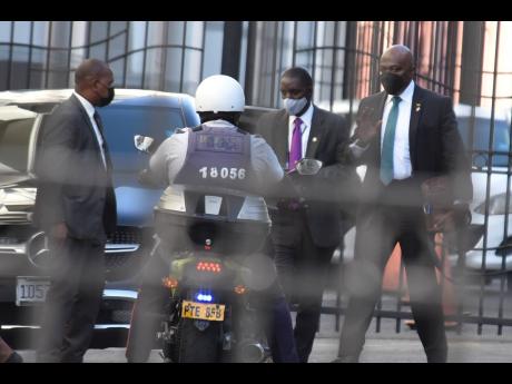 Police personnel outside the Home Circuit Court where the Clansman-One Don Gang trial is taking place.