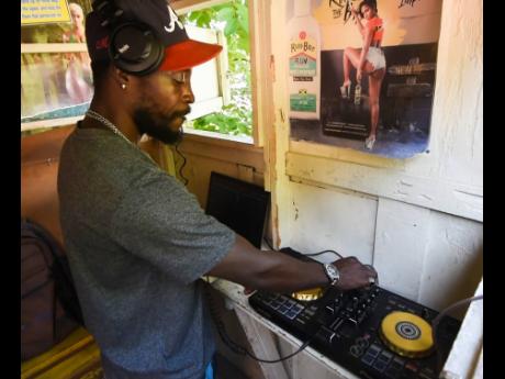 Ralston ‘DJ Rally’ Hardy shows his prowess at the turntables.