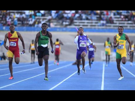 Calabar High School’s Rusean Young (second left) anchors the team to victory in the boys’ Class 0ne 4 x100m relays. However, the team was later disqualified at the  Gibson McCook Relays held at the National Stadium on Saturday, February 23, 2019.