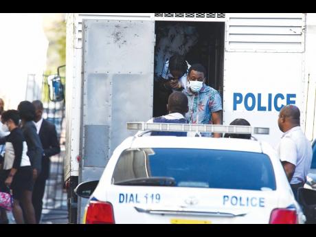 Defendants in the Clansman-One Don gang trial arrive at court.