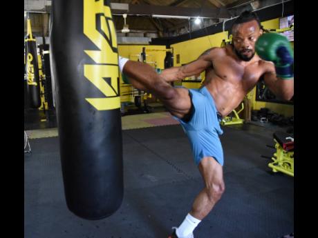 Mixed martial artist Damion ‘Dynamite’ Nelson during a training session at the Evolutionz Gym in Kingston on Tuesday.