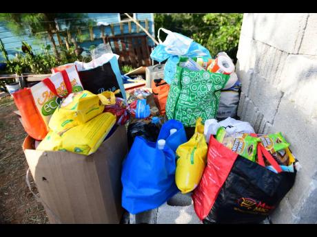Bags of food stuff and other essentials that were donated to the Tuckers yesterday.