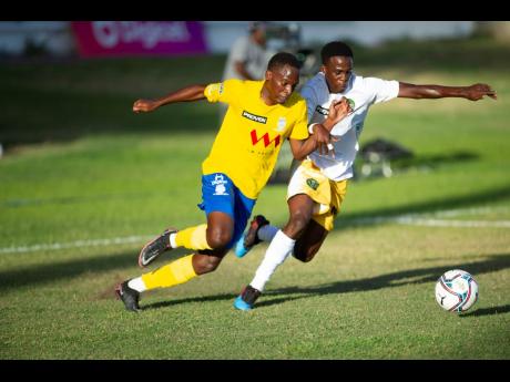 Harbour View’s Trayvone Allen (left) battles with Vere United’s Tyricke Harrison for the ball during their Jamaica Premier League match at Sabina Park in Kingston on Saturday.