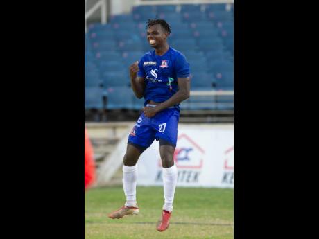 Dunbeholden’s Peter McGregor celebrates a goal against rivals Portmore United during their Jamaica Premier League game at Sabina Park in Kingston on Monday.