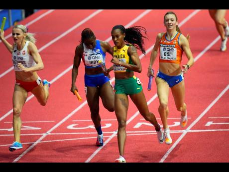 Credit: AP Jamaica’s Stephenie Ann McPherson (second right) crosses the finish line to win the Women’s 4x400m relay at the World Athletics Indoor Championships in Belgrade, Serbia yesterday.