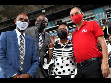 From left: ISSA President Keith Wellington, Jamaica Athletics Administrative Association First Vice-President Ian Forbes, Sport Minister Olivia Grange, and GraceKennedy Group Chief Executive Officer Don Wehby at the media launch of the 2022 ISSA/GraceKennedy Boys and Girls’ Athletics Championships at the National Stadium in Kingston yesterday.