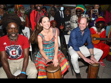Credit: Rudolph Brown Britain’s Prince William (right) and his wife, Kate, Duchess of Cambridge, play drums with Rastafarians in Trench Town, Kingston, during the royal couple’s visit to Culture Yard yesterday.
