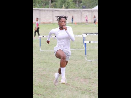 Edwin Allen High quarter miler Natasha Fox goes through drills during a training session at the school in Frankfield, Clarendon, on Tuesday.