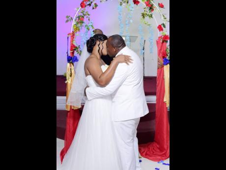 And they sealed it with a kiss. Newly weds Kenute and Carroline Williams moments after exchanging vows on Saturday.