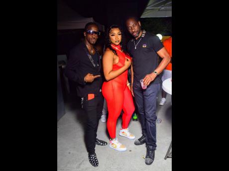 The flaming hot Daniiboo had a veteran on either side. At left is dancer Shelly Belly while the legendary Bounty Killer is on her right.