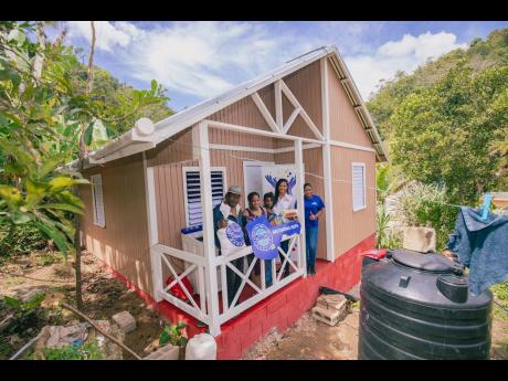 This house was handed over to Michael Miller and his family in Aenon Town, Clarendon.
