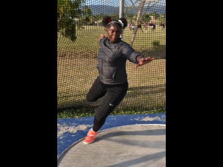 Cedricka Williams goes through her routine in the discus ring during a training session at G.C. Foster College in St Catherine on Tuesday.