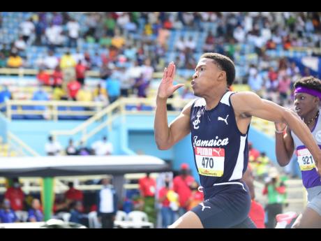 Jamaica College’s Mark Anthony Miller wins gold in the Class Two Boys 200m final at the ISSA/GraceKennedy Boys and Girls’ Athletics Championships at the National Stadium on Saturday. 