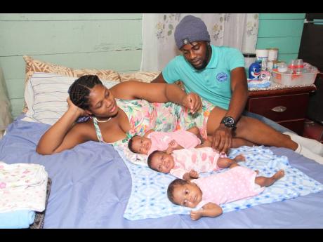 Clevone Nicholson with his partner Nyoaka Lindo share stories of their triplets Kamaya, Katalia and Kahlia who were born on February 22. 
