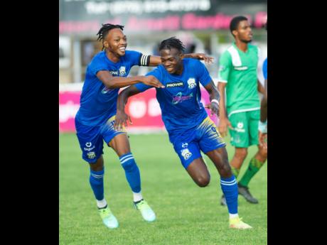 Molynes United’s Nicholas Nelson (left) and Jahiem Harris.