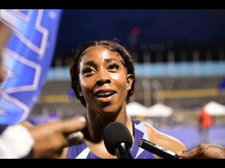 Fraser-Pryce speaks with journalists after her Women’s 200m final at Velocity Fest 11.