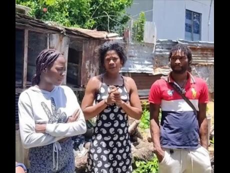 Christine Richards (centre) with two of her children Tameka and Oral Clarke.