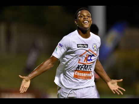 Mount Pleasant’s  Tarick Ximines celebrates after scoring against Molynes United at the Stadium East field on Monday night. 