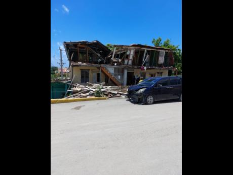 Demolition work on this building in Morant Bay, St Thomas was halted yesterday again following the discovery of a third set of bones. 