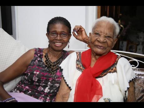 Centenarian Julia Campbell,105, relaxes at her Hayes, Clarendon home with her 75-year-old daughter, Marelyn Shaw.