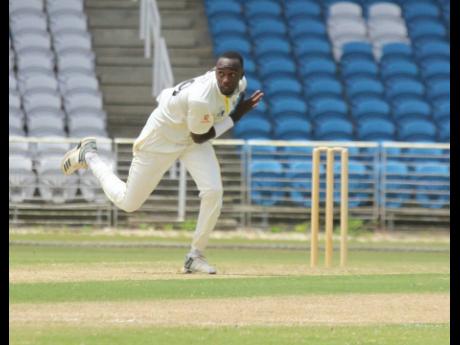 Jamaica Scorpions fast bowler Marquino Mindley in action against the Windward Island Volcanoes in the West Indies Four-Day Championship at the Brian Lara Cricket Academy in Tarouba, Trinidad, yesterday.