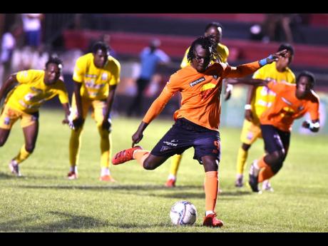 Tivoli Gardens’ Rodico Wellington takes a penalty kick during their Jamaica Premier League game against Molynes United at the Anthony Spaulding Sports Complex in Kingston on Monday.