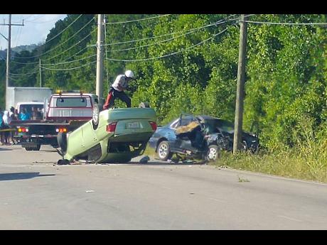 The vehicles that were involved in the February 2017 crash along the Martha Brae to Falmouth main road in Trelawny. Ten children were among the 13 persons who were injured.