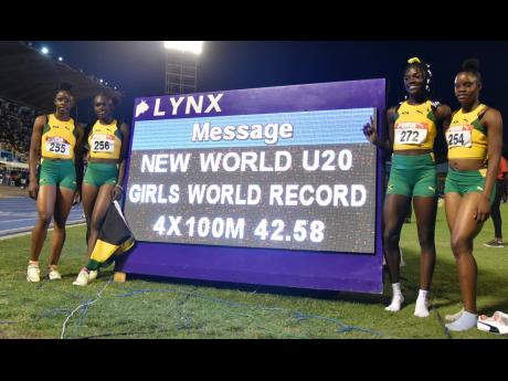 Jamaica’s girls’ Under-20 4x100m relay team celebrates a world record run of 42.58 during the Carifta Games at the National Stadium on Sunday, April 17. From left are Tina Clayton, Serena Cole, Brianna Lyston, and Tia Clayton. The time was, however, not ratified by World Athletics, making the record unofficial.