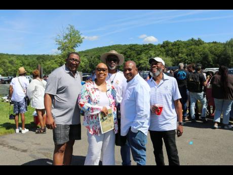 Richard Chambers (centre), one of the founders of the Trelawny annual picnic,  along with (from left) Baldwin Huie, Dahlia Gordon, Oliver Huie and Paul Earle at the annual Trelawny Day Picnic held on May 29. 