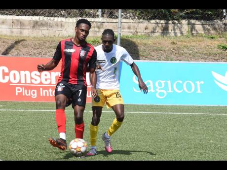 Renaldo Cephas (left) of Arnett Gardens is challenged by Vere United’s Trevance Salmon during a Jamaica Premier League game at the UWI-JFF Captain Horace Burrell Centre of Excellence in St Andrew on Monday, February 14.