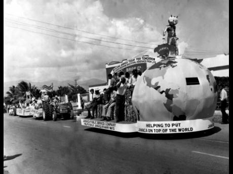 Participants in the Independence Float Parade make their way along the route.