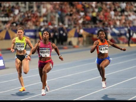 Shelly-Ann Fraser-Pryce (centre) wins the women’s 100m flanked by Marie-Josée Ta Lou of The Ivory Coast (right), and Switzerland’s Ajla Del Ponte during the Wanda Diamond League meeting at Charlety Stadium in Paris, France on Saturday.