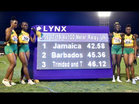 Jamaica’s girls’ Under-20 4x100m relay team celebrates a world record run of 42.58 during the Carifta Games at the National Stadium on Sunday, April 17. From left are Tina Clayton, Serena Cole, Brianna Lyston, and Tia Clayton. However, as a drug test was not administered to one member of that team after the race, the record was not ratified by World Athletics.