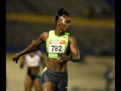 Shericka Jackson crosses the line in 21.55 seconds to take the women’s 200m crown at the JAAA National Senior Championships at the National Stadium in Kingston last night.