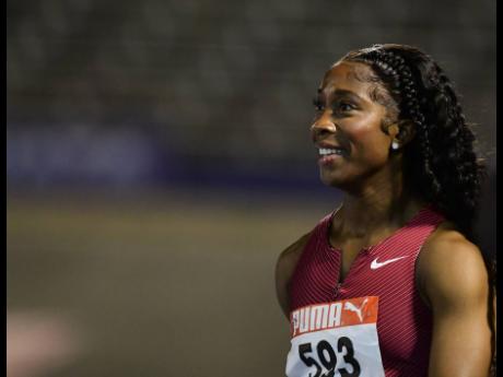Shelly-Ann Fraser-Pryce is all smiles after winning her 100m heat in 10.70 seconds at the JAAA National Senior Championships at the National Stadium last night.