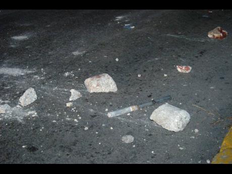 The accused woman allegedly threw stones at a car causing damages of $355,000.