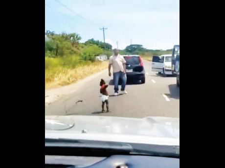 Screen grab of baby wandering onto the main road in the vicinity of the McCooks Pen community off Old Harbour Road in St Catherine on Monday.