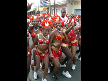 A group of revellers in a joyous mood along King Street in downtown Kingston as they participate in the Downtown Kingston Carnival in 2005.