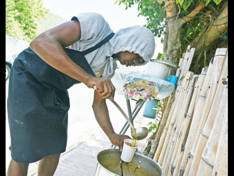 Shaquelle Lowe, who says that he looks up to World Champion long jumper Tajay Gayle, serves up a cup of his tasty soup.