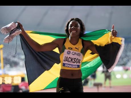 Jackson celebrates after placing third in the 400m at the 2019 World Championships in Doha, Qatar.