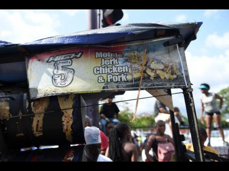 Spaulding’s High 5 Mobile Jerk Chicken and Pork food spot kept revellers fed during Sunday’s carnival road march.