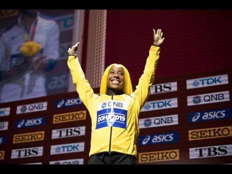 Fraser-Pryce celebrating her 100m gold medal at the last World Championships in Doha, Qatar.