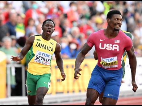 Jamaica’s Oblique Seville (left) crosses the line fourth, behind winner Fred Kerley (right), in the Men’s 100m final at the World Athletics Championships in Eugene, Oregon, on Saturday.