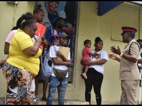 Inspector France Morrison (right) speaks with the protesters. 